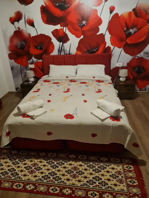 Postel nebo postele na pokoji v ubytování Conacul Ancuței