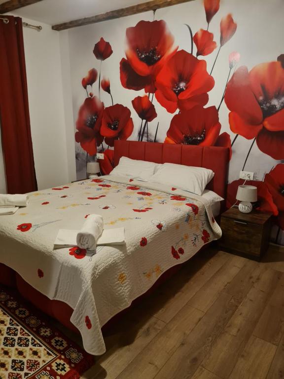 Postel nebo postele na pokoji v ubytování Conacul Ancuței