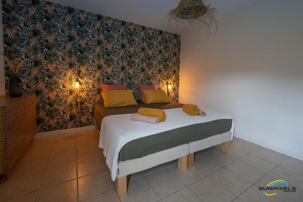 Postel nebo postele na pokoji v ubytování TI'KAZANOU