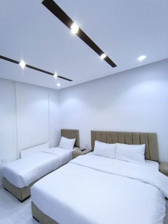 Postel nebo postele na pokoji v ubytování Mussa Spring Hotel