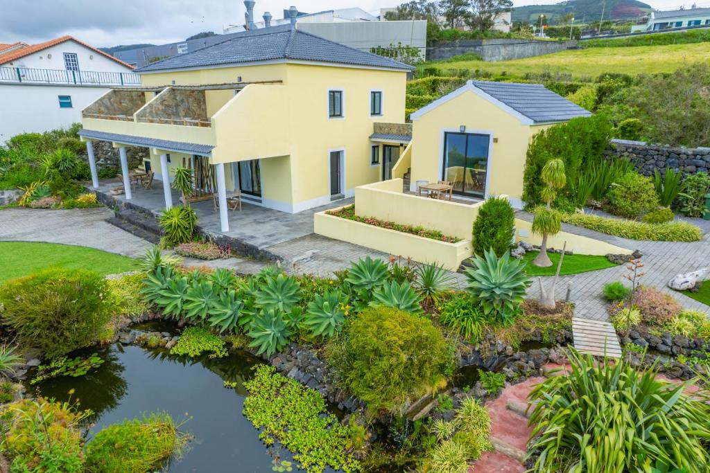 an aerial view of a house with a pond at Casa dos Lagos - RRAL nº 2187 in Velas