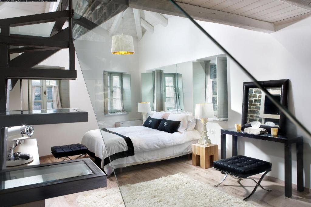 Postel nebo postele na pokoji v ubytování Mikro Papigo 1700 Hotel & Spa