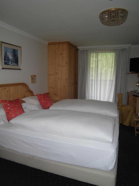 Postel nebo postele na pokoji v ubytování Hotel Evaldo