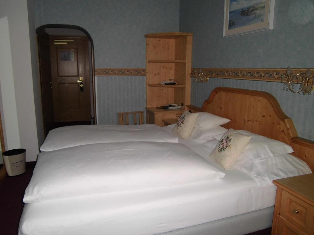 Postel nebo postele na pokoji v ubytování Hotel Evaldo