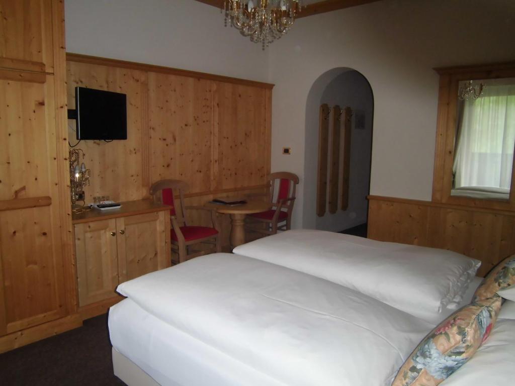 Postel nebo postele na pokoji v ubytování Hotel Evaldo