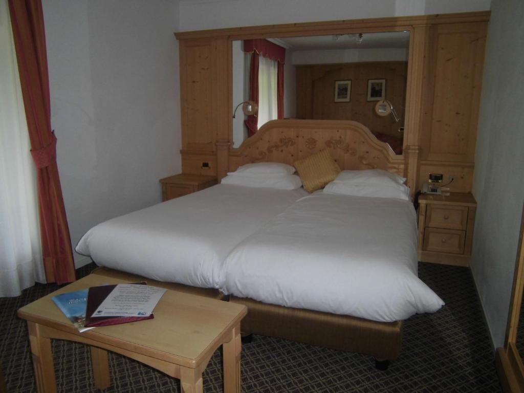Postel nebo postele na pokoji v ubytování Hotel Evaldo