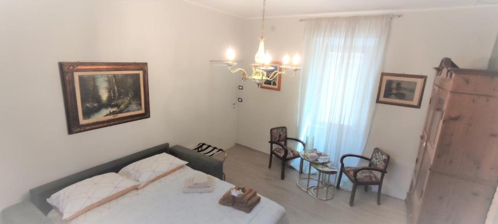 Postel nebo postele na pokoji v ubytování Palazzo NiTe