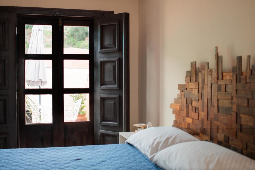 Postel nebo postele na pokoji v ubytování Hostal Encounter Guanajuato