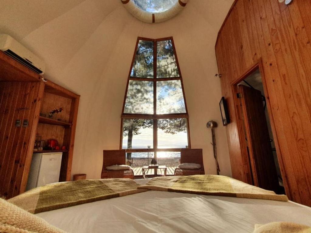 Cama ou camas em um quarto em Magma Lodge, Pucon
