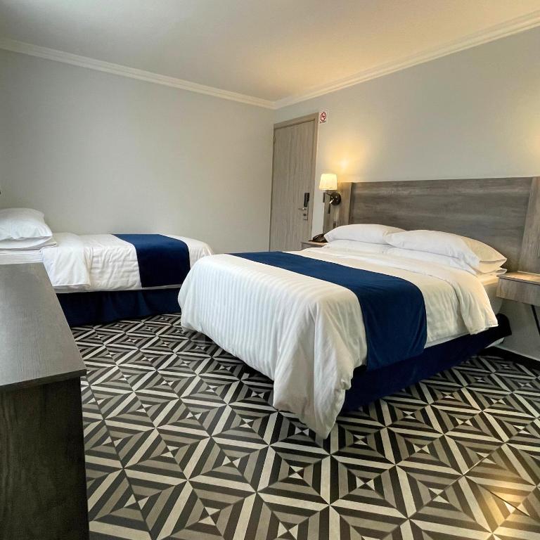 Postel nebo postele na pokoji v ubytování Hotel Esfera Tulancingo