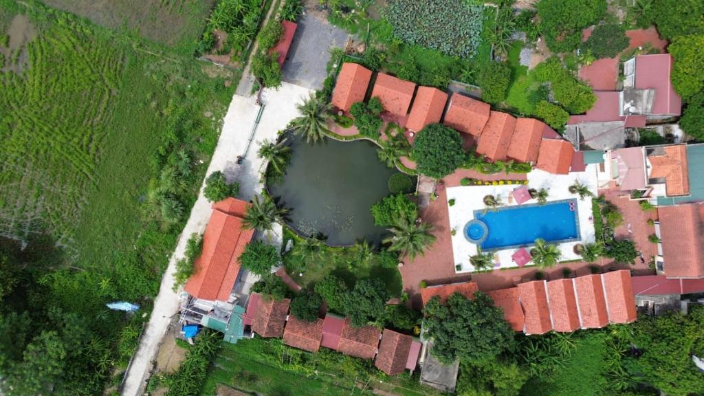 an overhead view of a house with a pond at Tam Coc Green Garden Bungalow in Ninh Binh