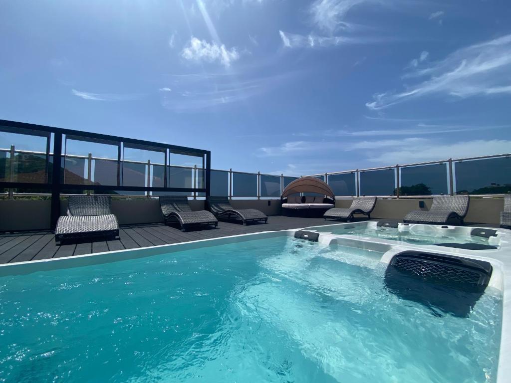 a swimming pool on the roof of a building at Myah's Hotel in Brighton Village