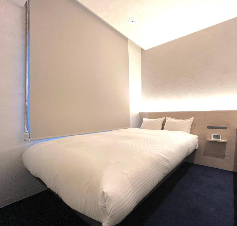 Postel nebo postele na pokoji v ubytování ABiz hotel