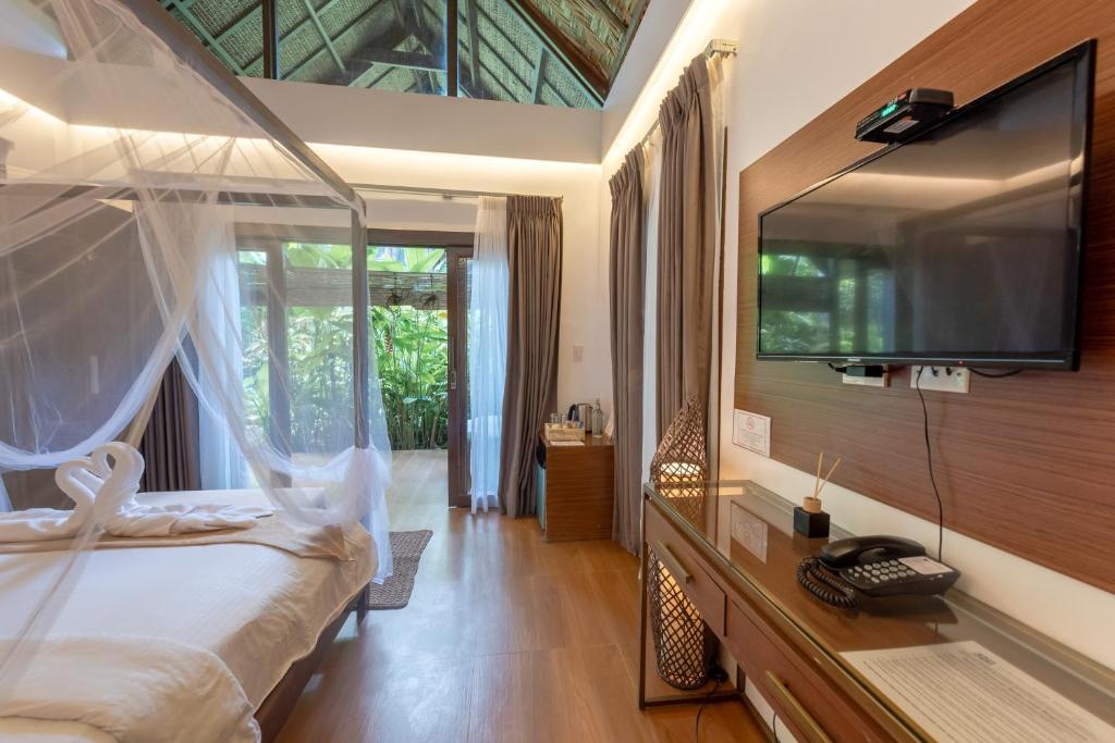 Postel nebo postele na pokoji v ubytování The Hillside Resort Siargao
