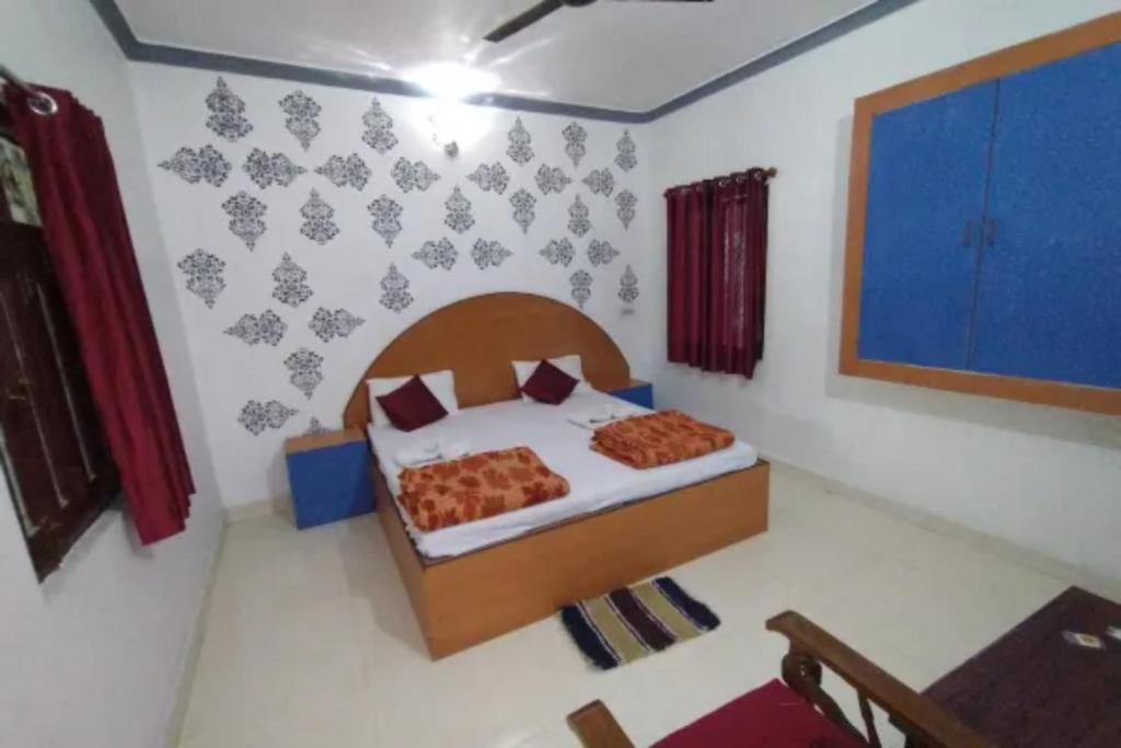Postelja oz. postelje v sobi nastanitve GRG Mohit Paying Guest House Varanasi