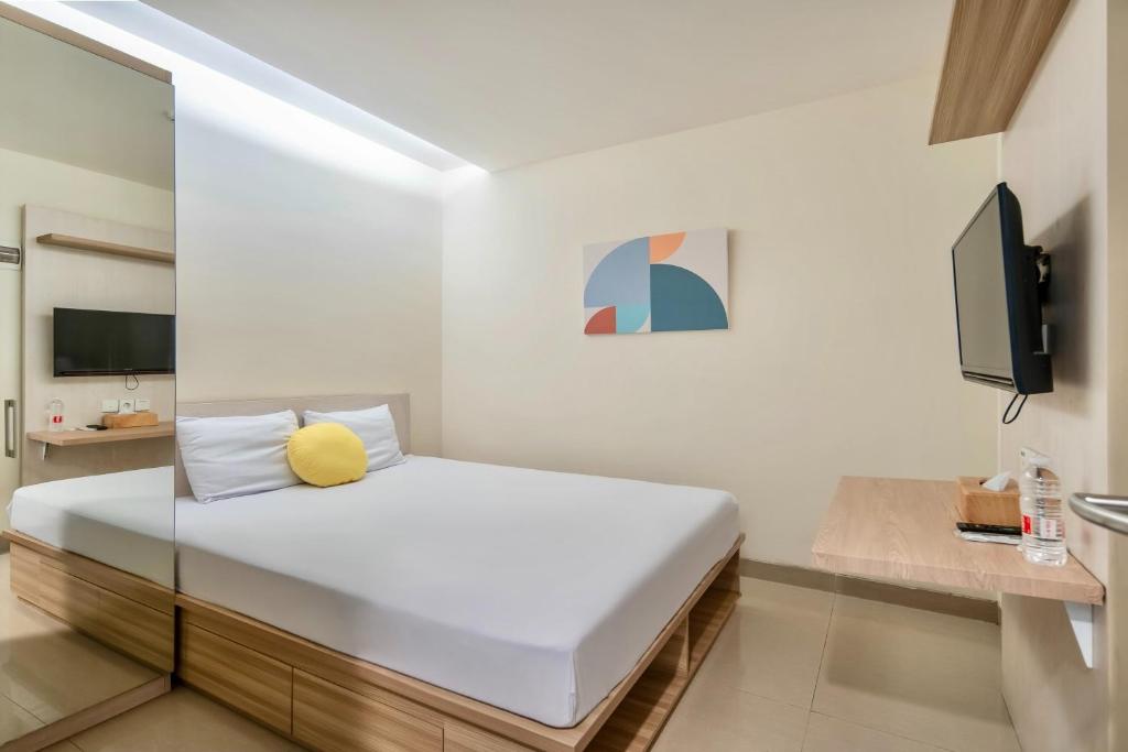 Ένα ή περισσότερα κρεβάτια σε δωμάτιο στο Cove Guntur Heritage