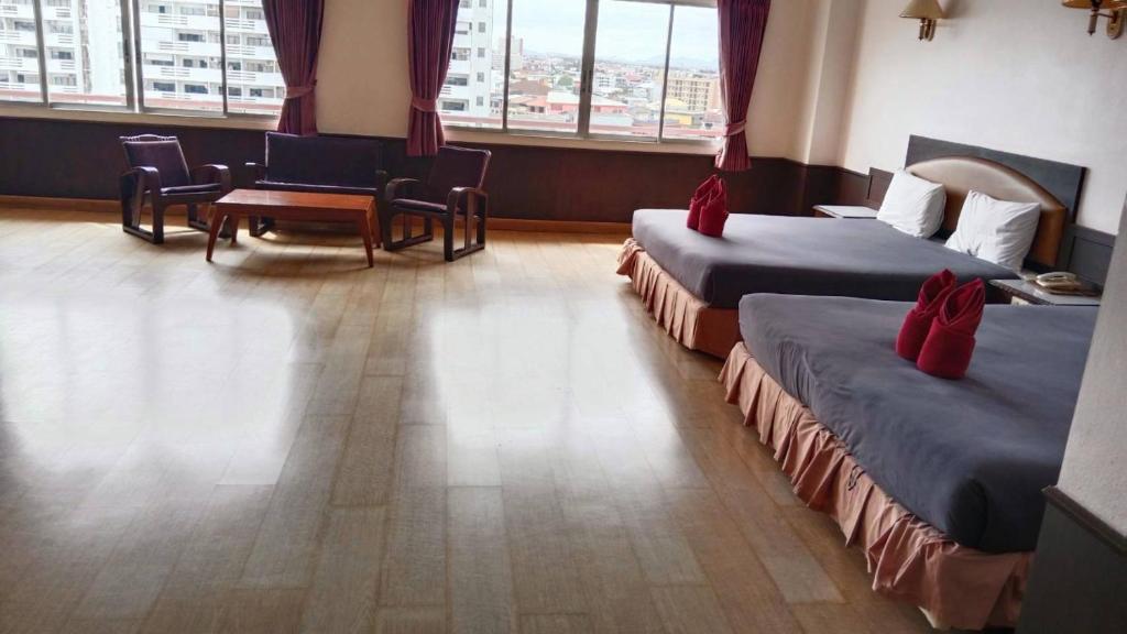 Postel nebo postele na pokoji v ubytování Marine Yensabai Pattaya