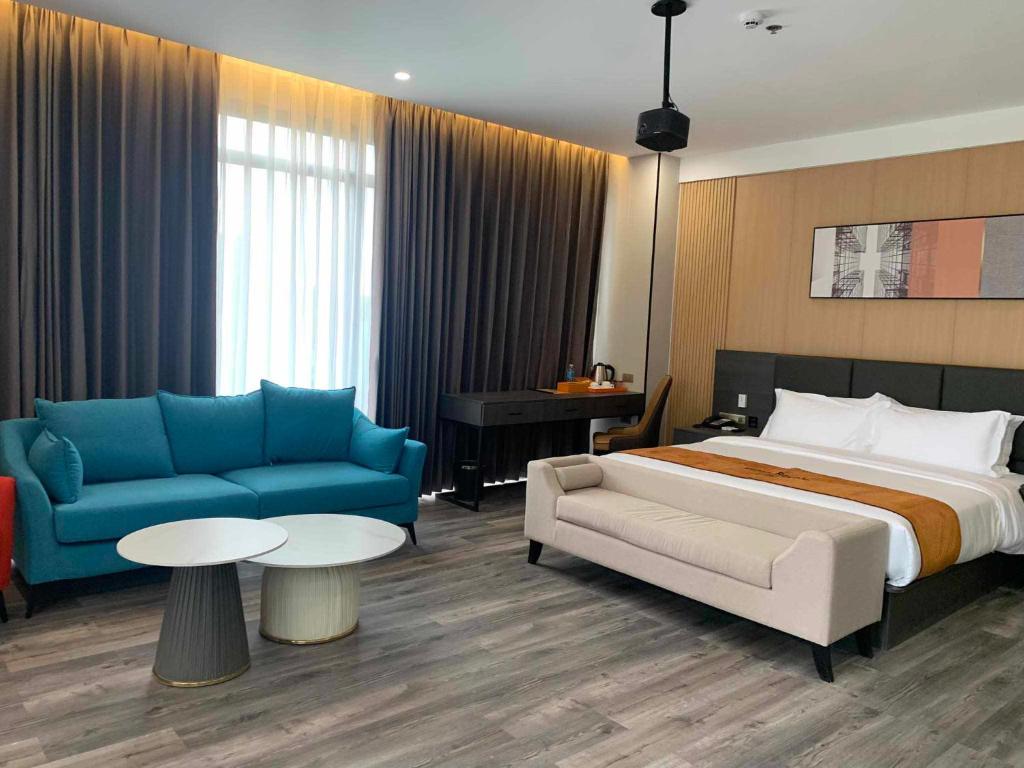 Postel nebo postele na pokoji v ubytování Venus Royale Hotel