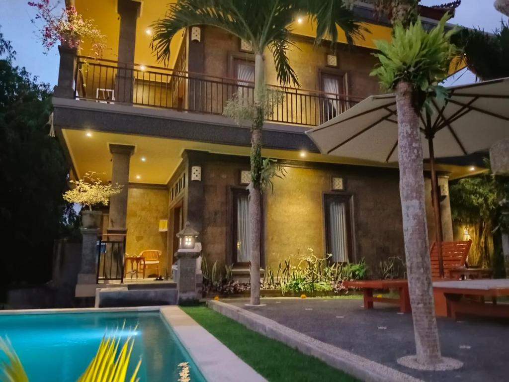 Bazén v ubytování Ketut Kasta Guest House nebo v jeho okolí
