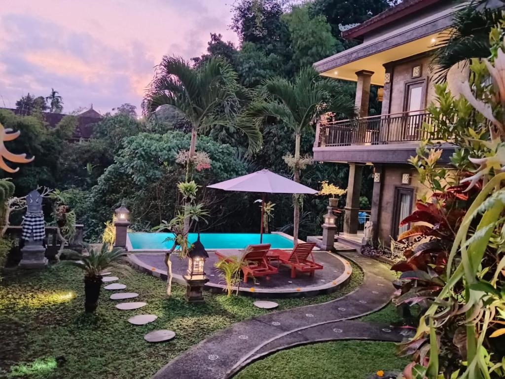 Bazén v ubytování Ketut Kasta Guest House nebo v jeho okolí