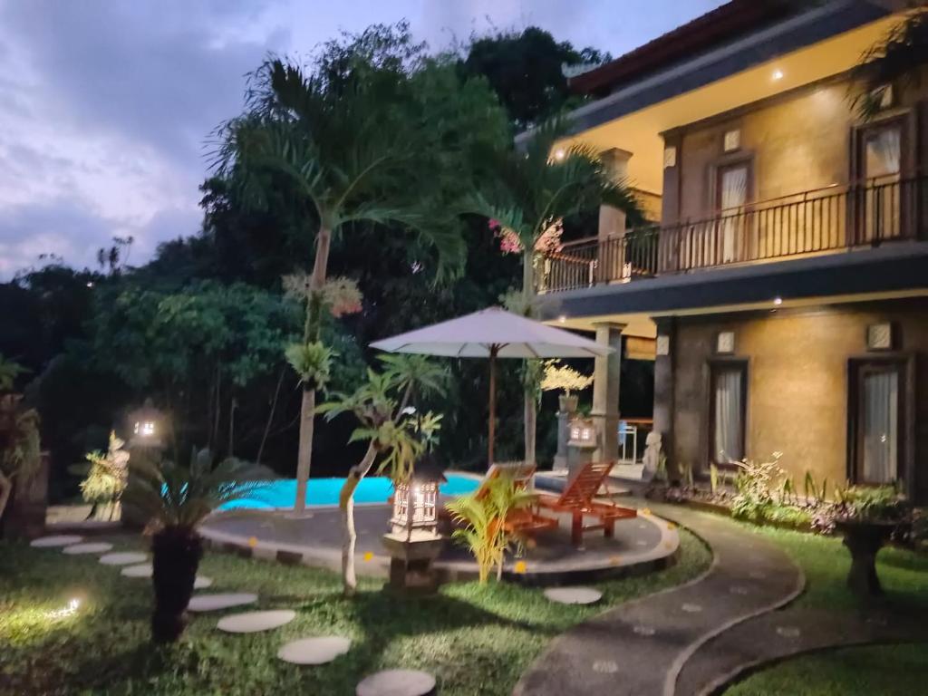 Bazén v ubytování Ketut Kasta Guest House nebo v jeho okolí