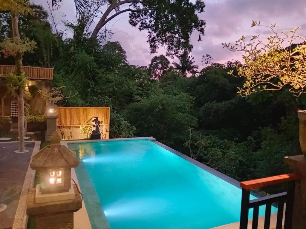 Bazén v ubytování Ketut Kasta Guest House nebo v jeho okolí