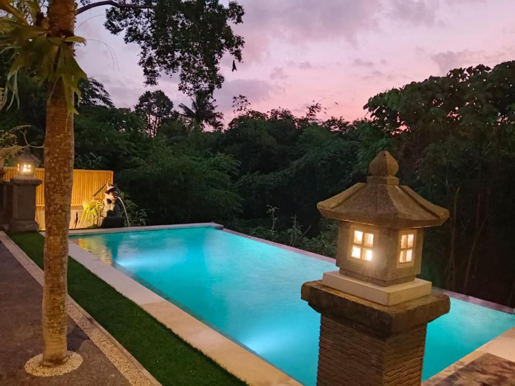 Bazén v ubytování Ketut Kasta Guest House nebo v jeho okolí