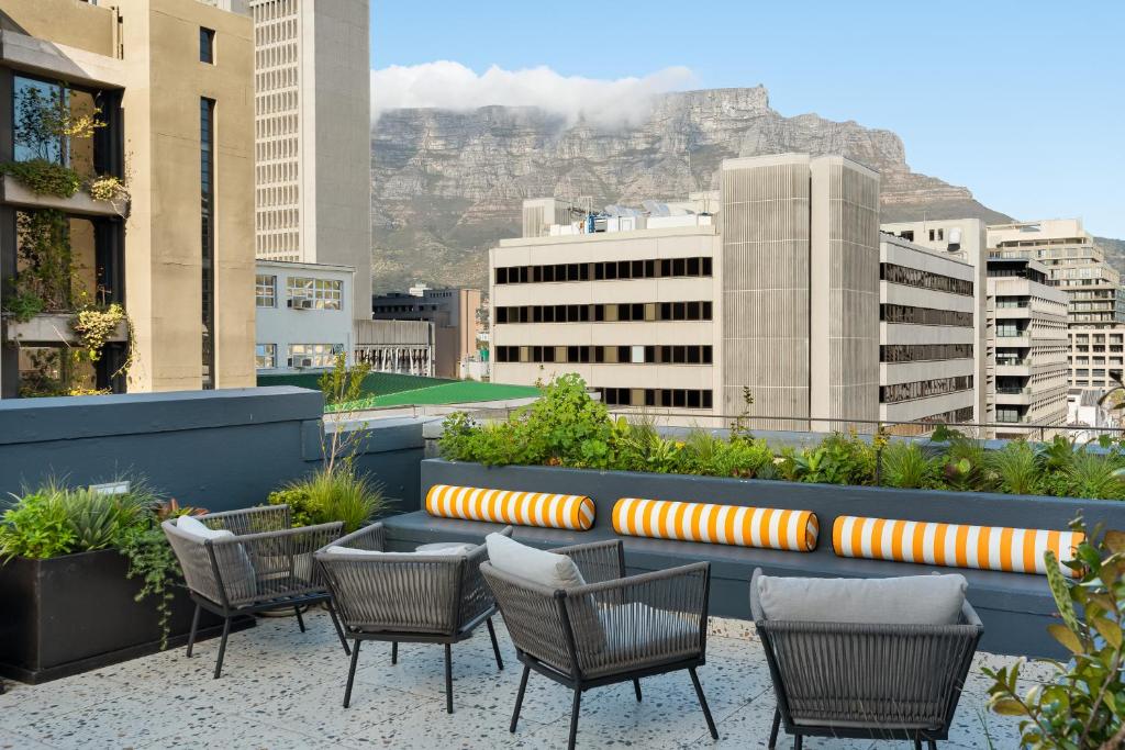 a group of chairs sitting on top of a roof at The Carrington Aparthotel by Totalstay in Cape Town