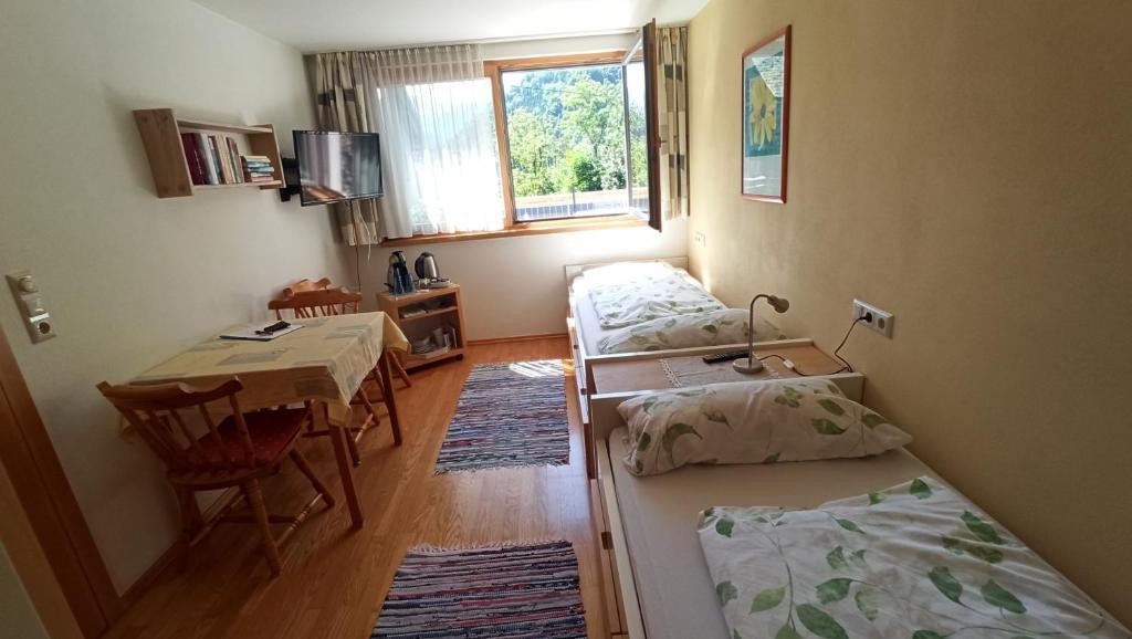 Postel nebo postele na pokoji v ubytování Gästehaus Lutz