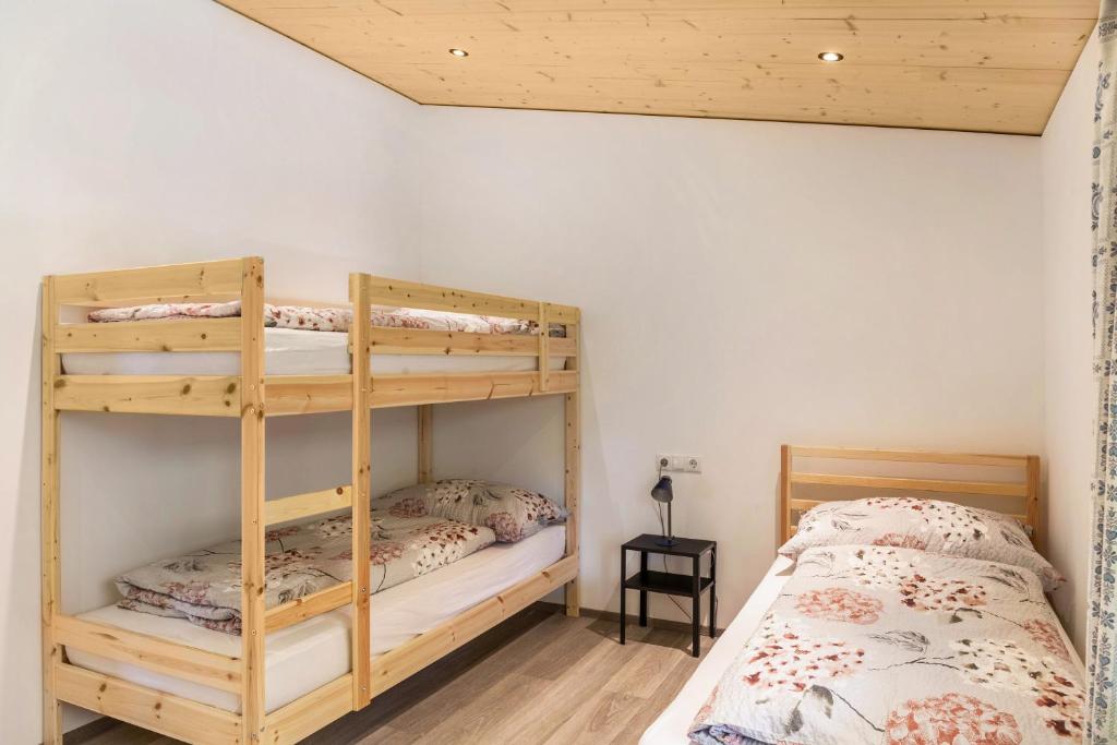Postel nebo postele na pokoji v ubytování Kwelle zur Natur Gamsberg