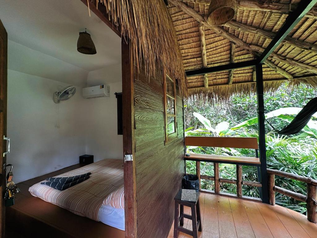 Postel nebo postele na pokoji v ubytování Oasis Koh Chang