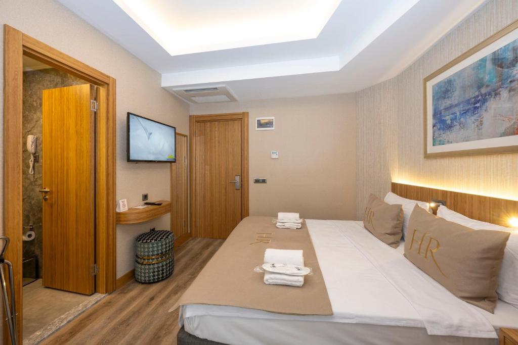 Postel nebo postele na pokoji v ubytování Hotel Ravi