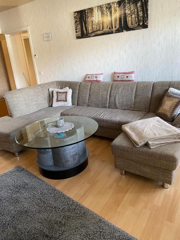 a living room with a couch and a coffee table at Gemütliche Ferienwohnung in Remscheid
