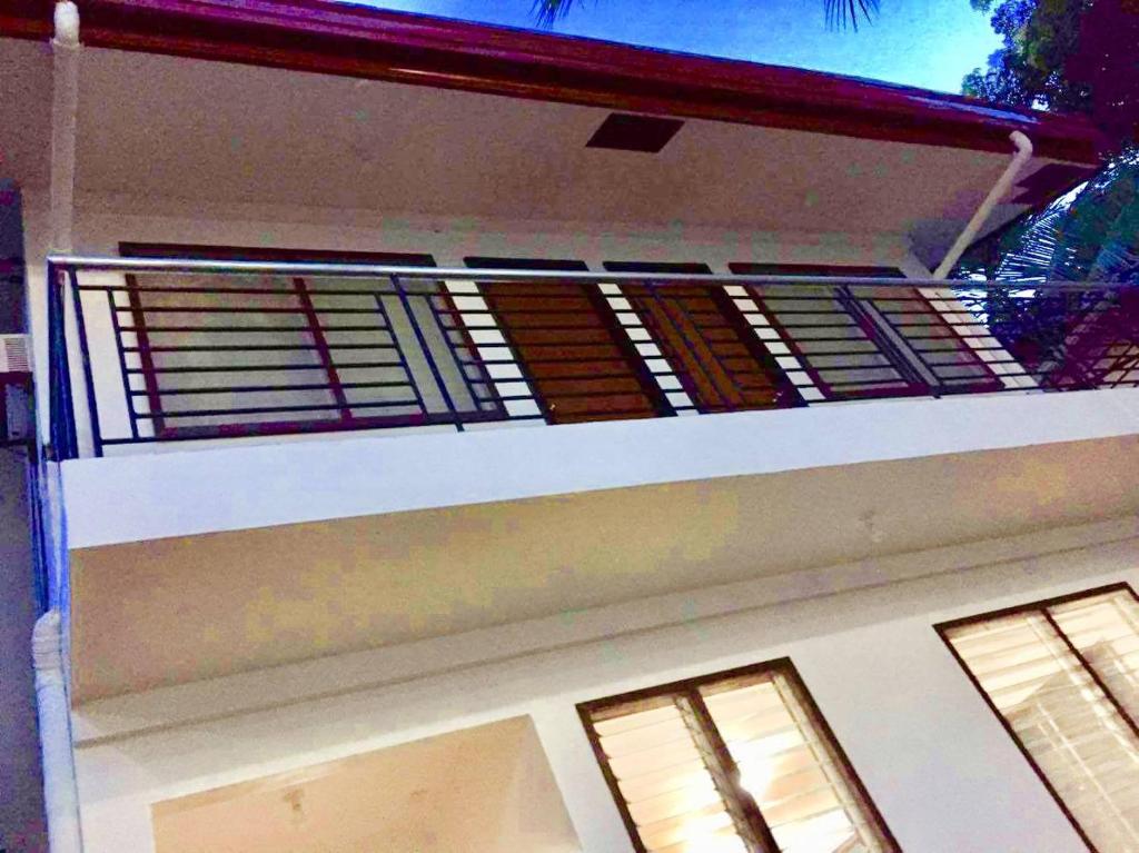 a balcony on the side of a house at Gaea's Apartments in Panglao