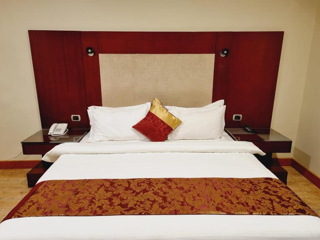 Postel nebo postele na pokoji v ubytování رؤوم ان للشقق الفندقية-Raoum Inn Hotel Apartments