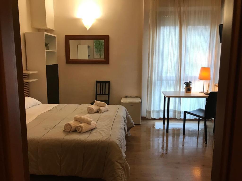 Postel nebo postele na pokoji v ubytování Civico 19