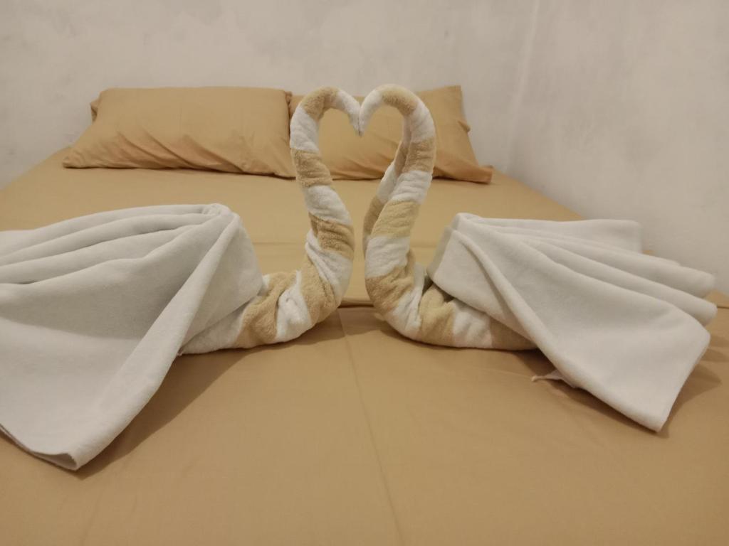 Posteľ alebo postele v izbe v ubytovaní Hendi Homestay