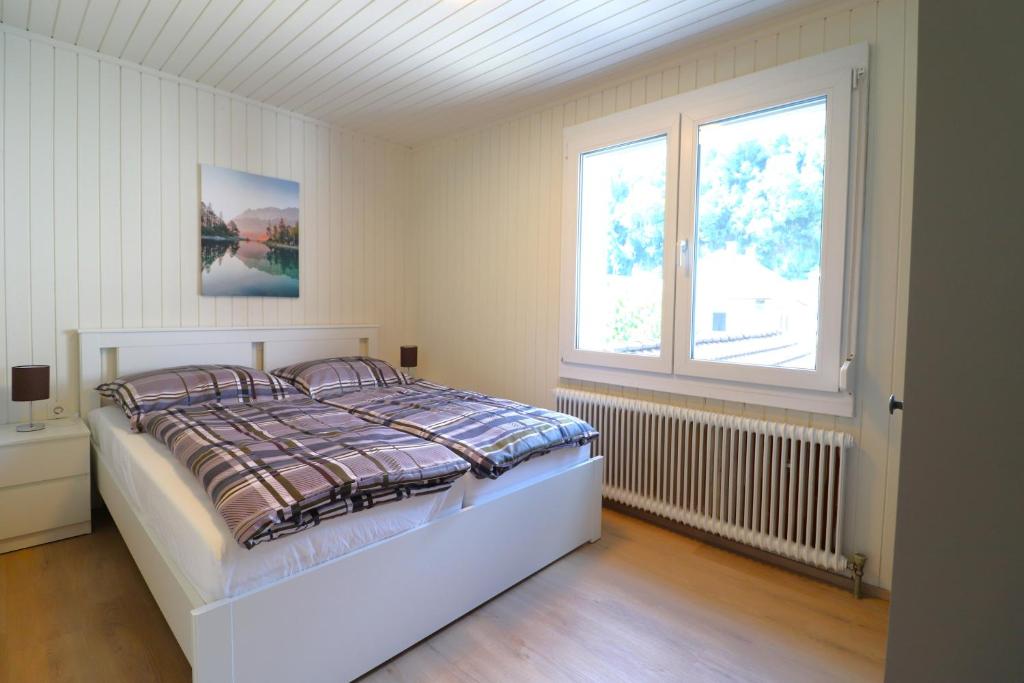 Postel nebo postele na pokoji v ubytování Montfort Apartments - Feldkirch