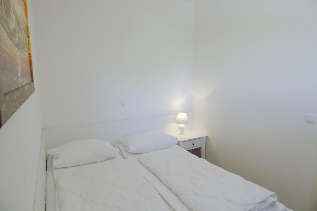 Postel nebo postele na pokoji v ubytování Goldene Ruh App 406 inkl WLAN