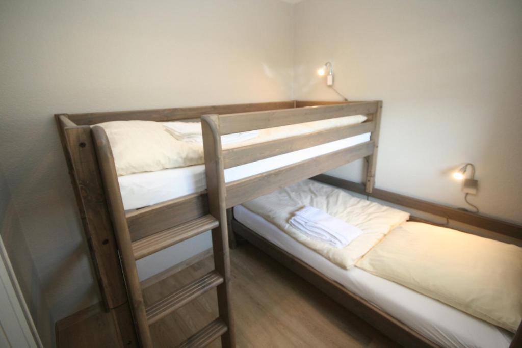 Postel nebo postele na pokoji v ubytování Strandschloss App 49