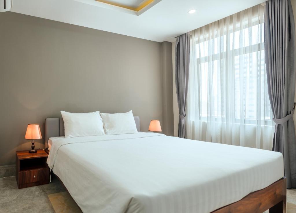 Postel nebo postele na pokoji v ubytování SOHO Residence