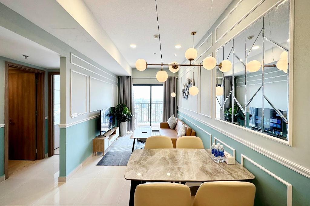 a dining room with a table and chairs at Yu Stay Apartment in Soho D1 near Bui Vien walking street in Ho Chi Minh City