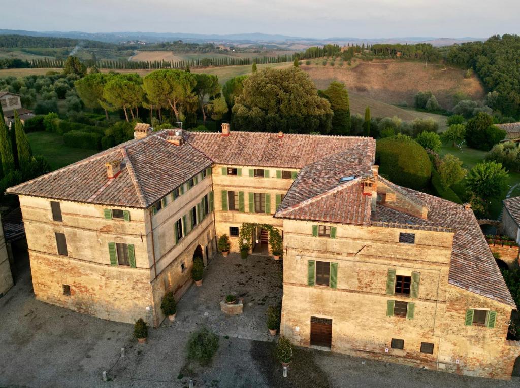 an aerial view of a large stone building at Ca' Bianca Tuscany Relais in Siena