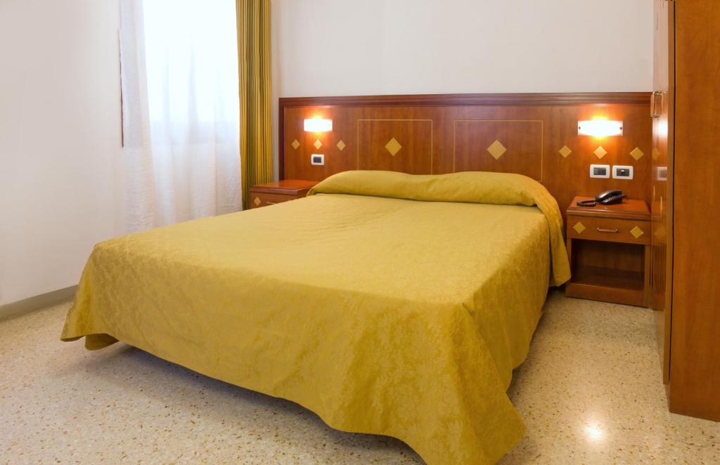 Postel nebo postele na pokoji v ubytování Hotel Adriatico