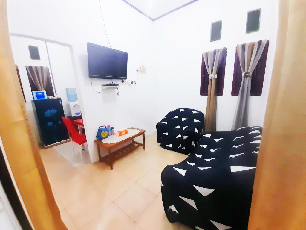 TV a/nebo společenská místnost v ubytování Baronda Guest House