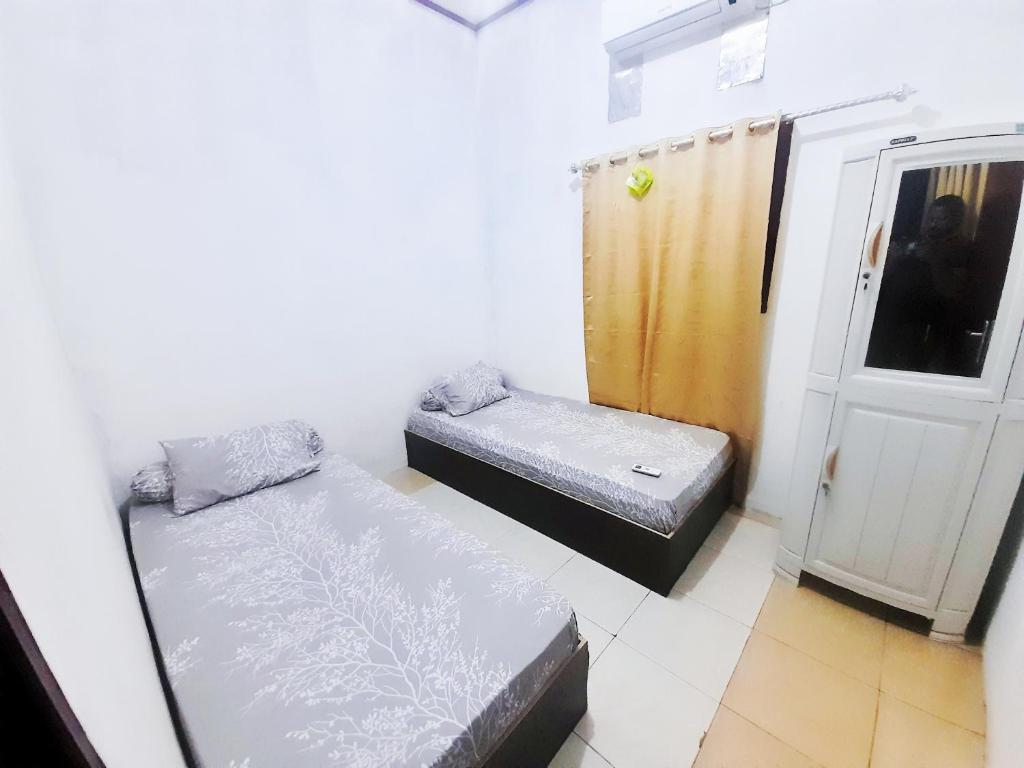 Postel nebo postele na pokoji v ubytování Baronda Guest House