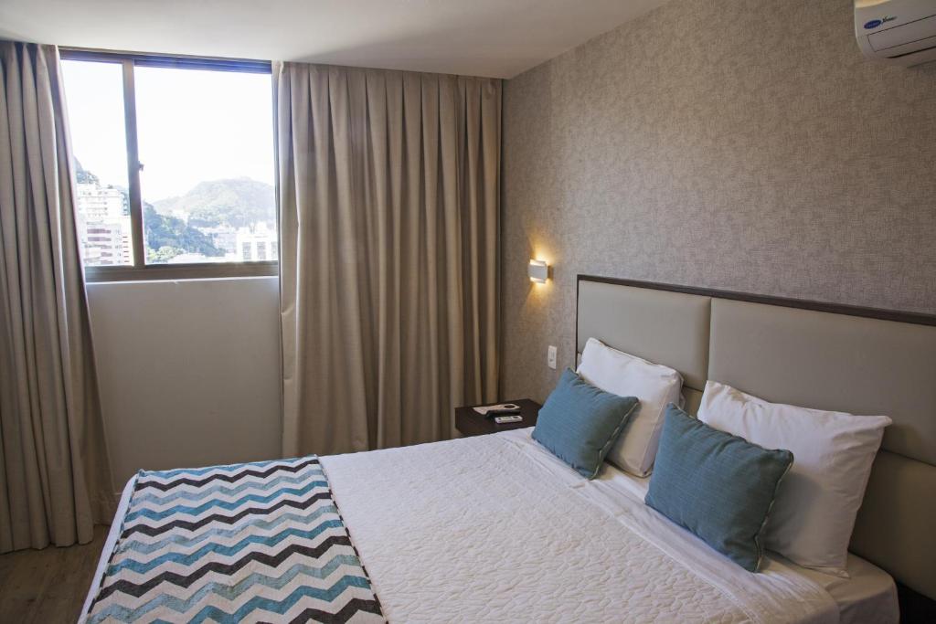 Кровать или кровати в номере Mirador Rio Copacabana Hotel