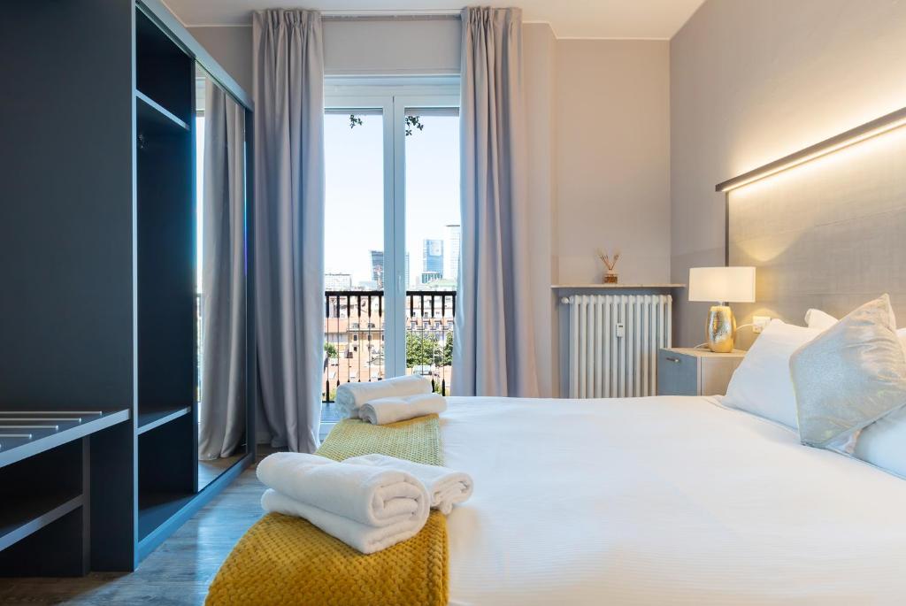 Кровать или кровати в номере Milan Retreats