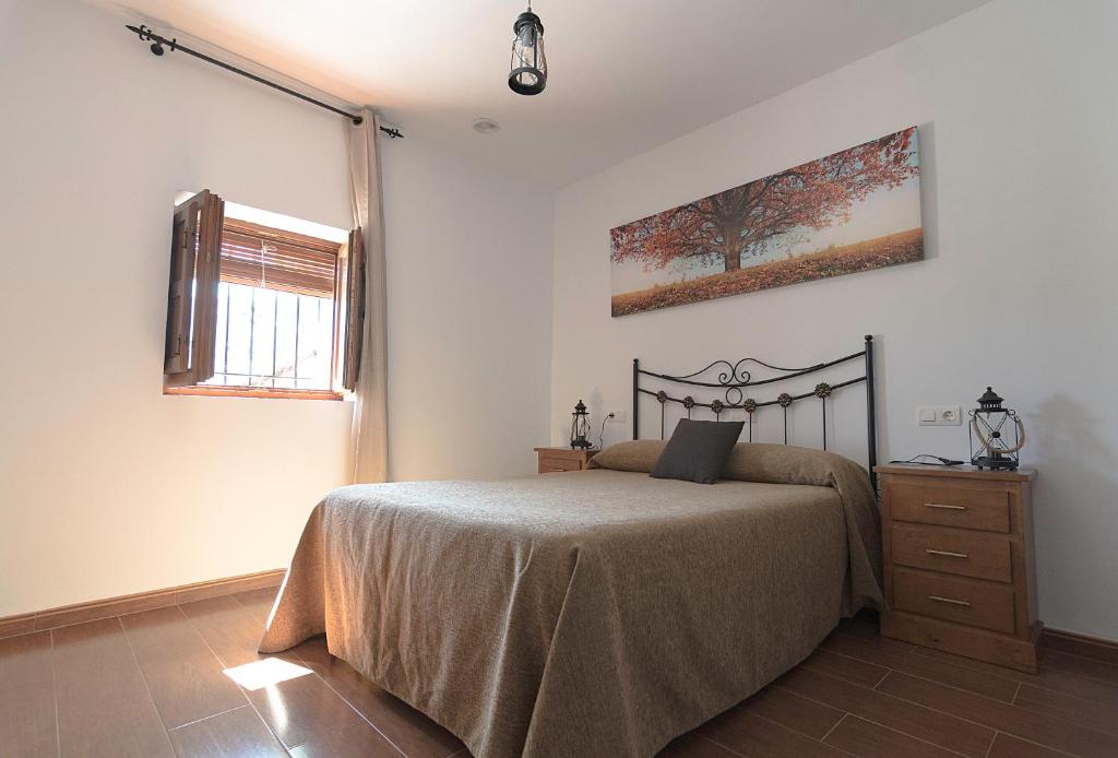Cama o camas de una habitación en Apartamentos Rurales Las Chimeneas