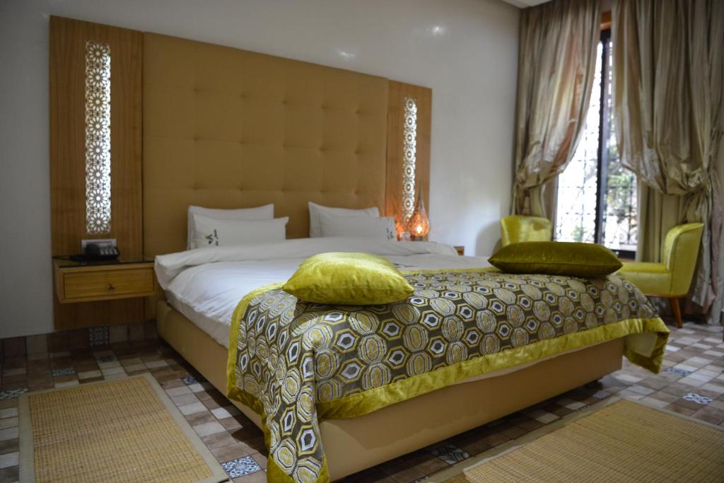 Postel nebo postele na pokoji v ubytování Aralia Boutique Hôtel